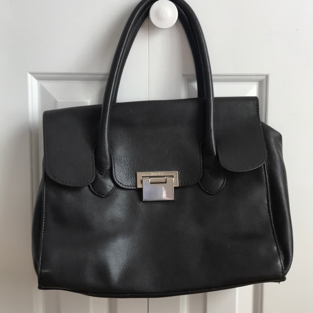 Genuine dark brown leather purse.